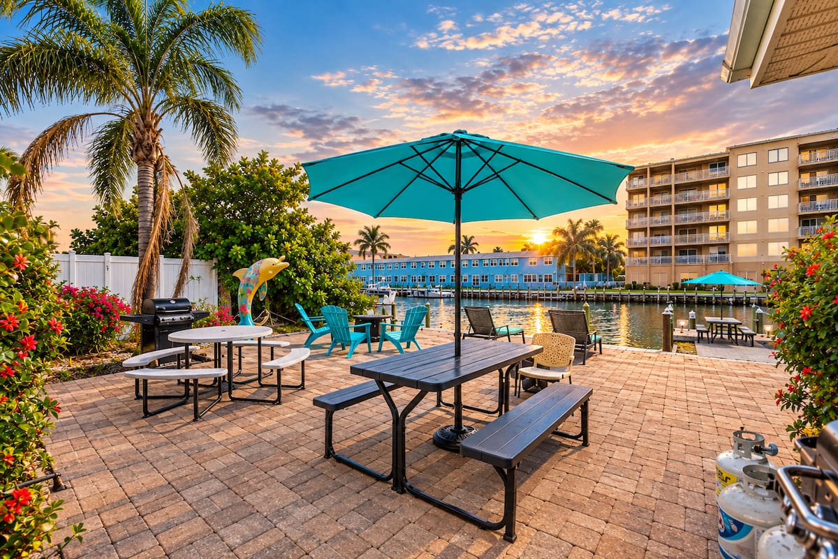 Waterfront patio with umbrella at sunset on Treasure Island